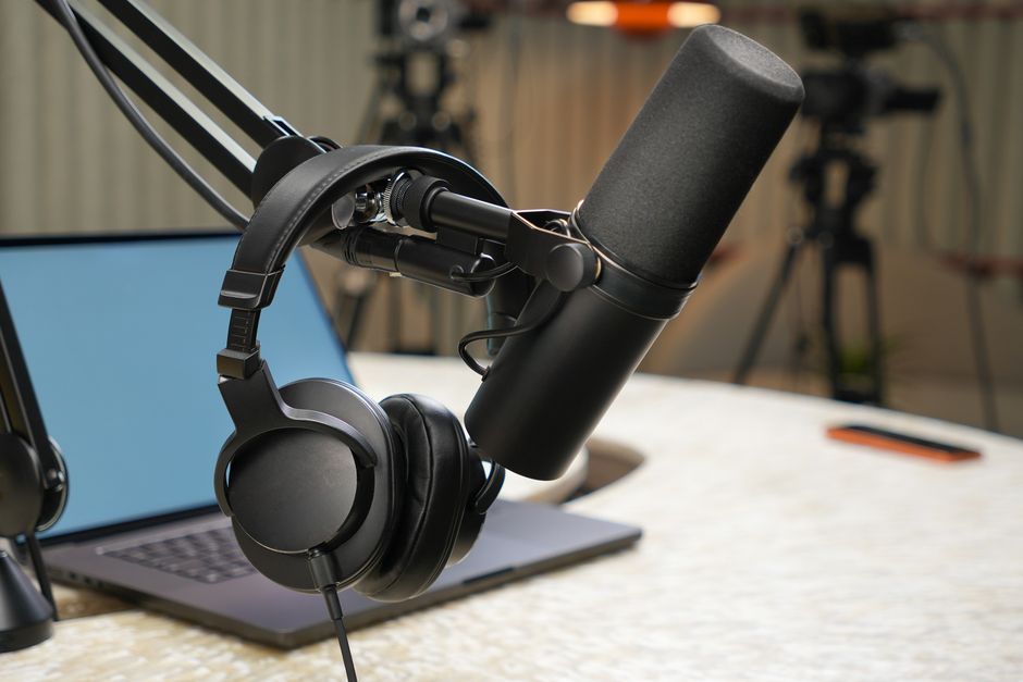 Professional studio headphones and multi-channel USB audio interface on studio console